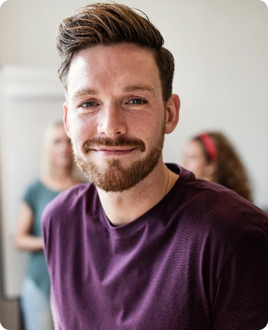 young-designer-smiling-confidently-in-an-office-af-2024-09-16-16-08-08-utc@2x